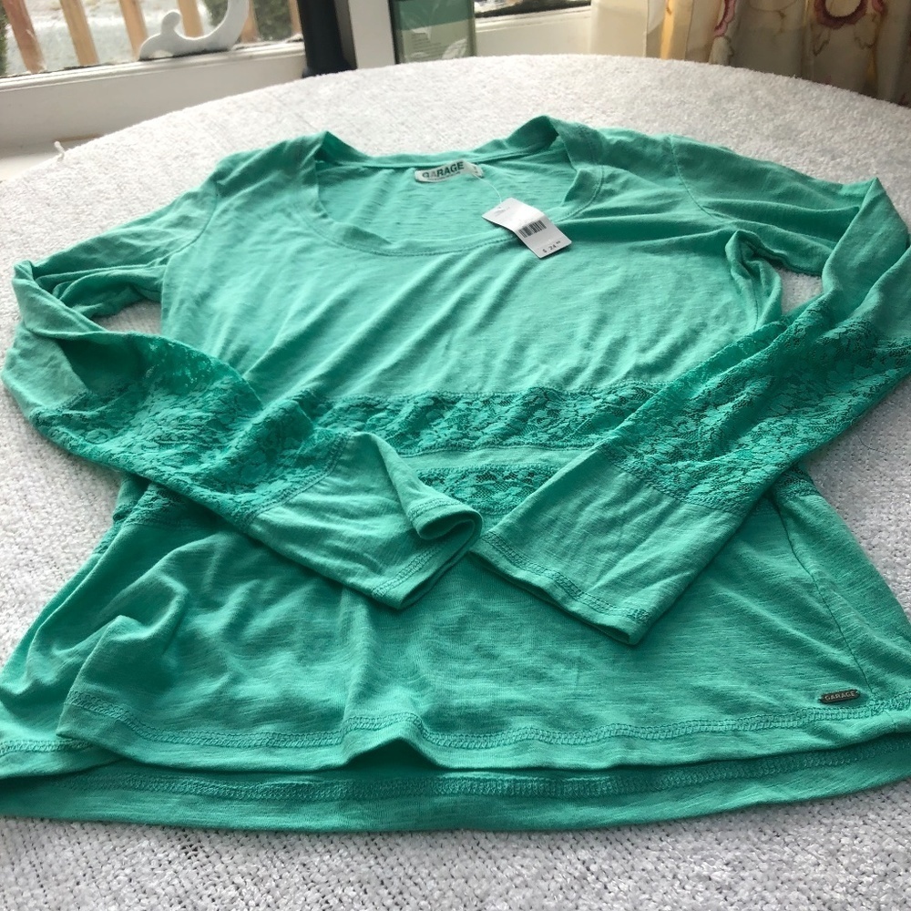 New green size large Garage long sleeved  top, lacy inserts